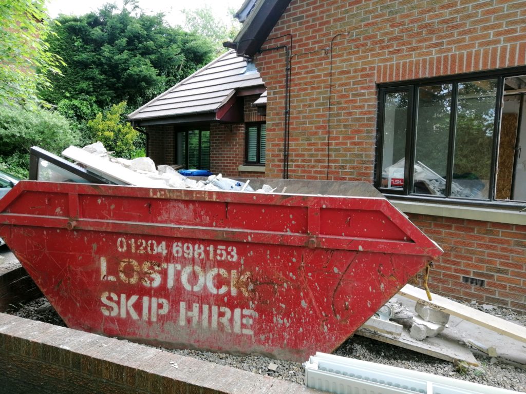 Lostock Skips Ouside New House
