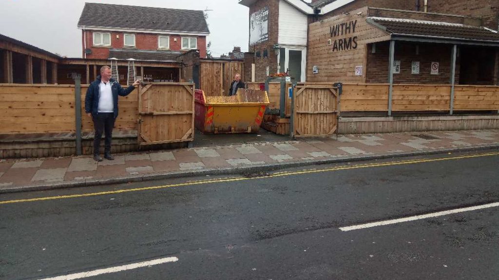 Skip Hire Bolton placed within grounds of construction work on a house