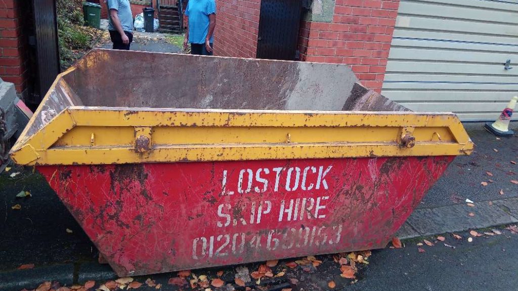 Lostock Skip Placed at the end of Driveway on the road