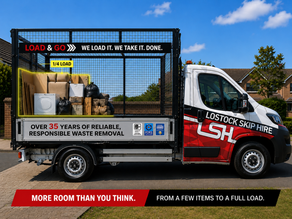 Branded skip-hire truck with its loaded cargo area full of boxes and bags, parked on a suburban street under a blue sky.